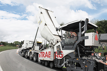 Concrete processing machine in road construction on a road