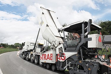 Concrete processing machine in road construction on a road