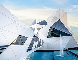 Crystal-Shaped building of the Sky Venture facility on Yas Island, featuring a white facade and large glass surfaces