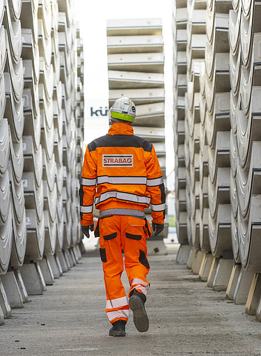 A construction worker with a helmet at work at dizzy heights