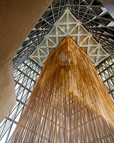 A ceiling construction with hanging brown bars