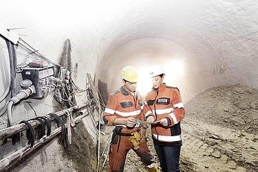 Two workers in a tunnel