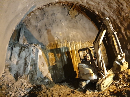 small excavator in a tunnel