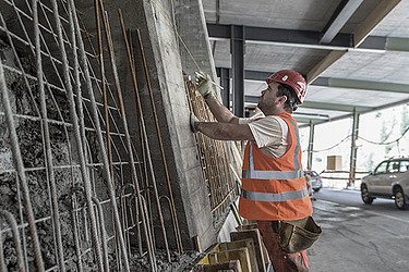 A worker working on steel gratings