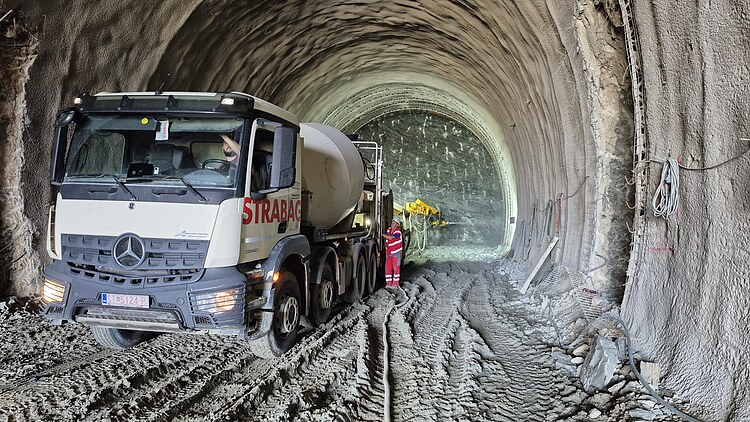 Preparations for the tunnel project with a STRABAG-branded truck inside the tunnel