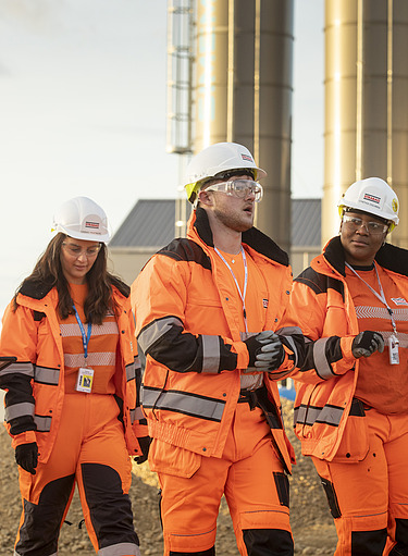 Four workers on a construction site for tunnelling